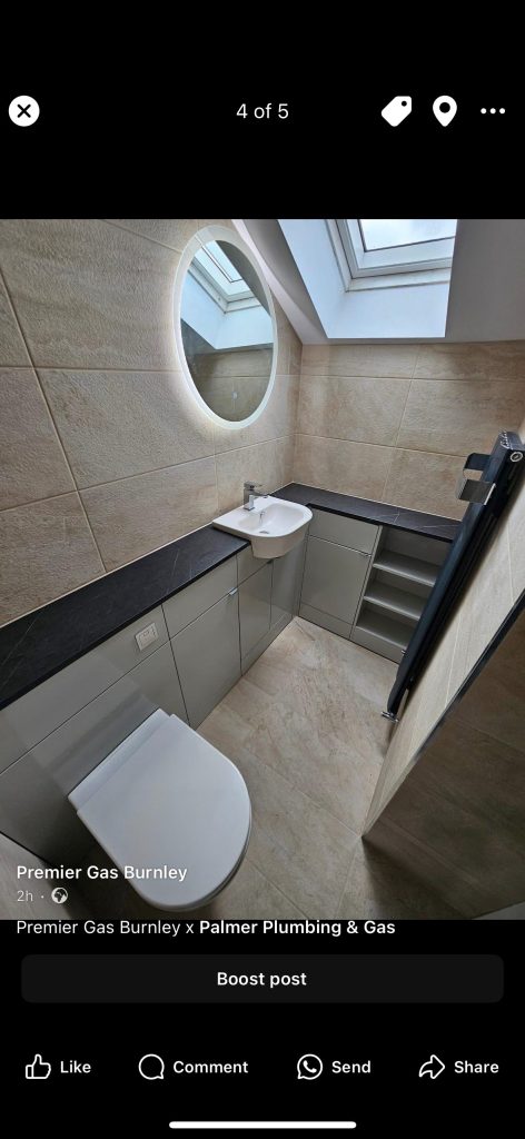 Beige tiled bathroom installation by Premier Gas Burnley