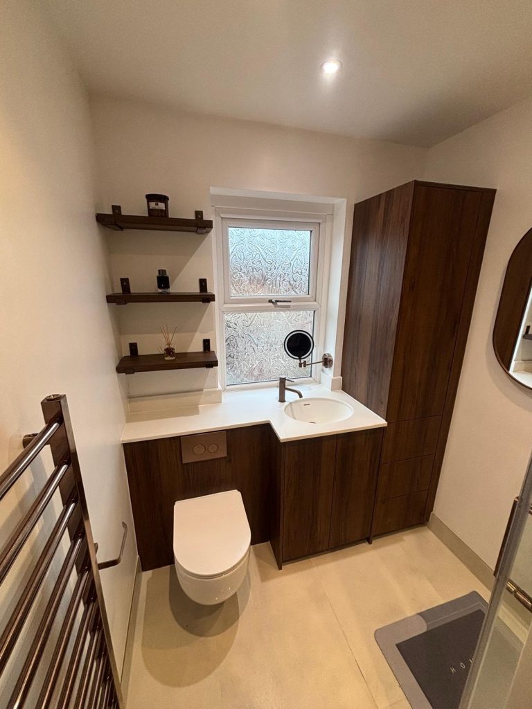 Walnut fitted bathroom furniture installed by Premier Gas Burnley